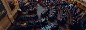 An image of various members of the Virginia General Assembly sitting at their desks.