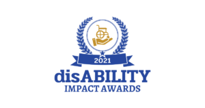A gold hand holding an empty wheelchair. The words, disABILITY Impact awards, is written beneath it.