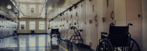 An image inside a jail with multiple accessibility devices (wheelchairs, walker, etc.)