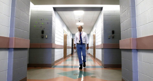 A man walking down a hall.