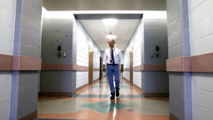 A man walking down a hall.