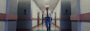 A man walking down a hall.