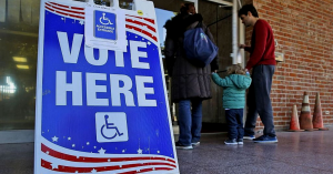 A sign that says "vote here."