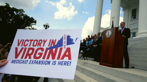 Governor Ralph Northam talking to a large group of Virginians at the Virginia state capitol.