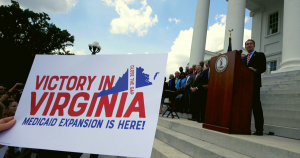 Governor Ralph Northam talking to a large group of Virginians at the Virginia state capitol.