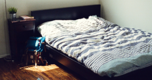 An empty room with only a bed.