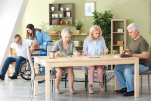 Happy senior people spending time together in nursing home