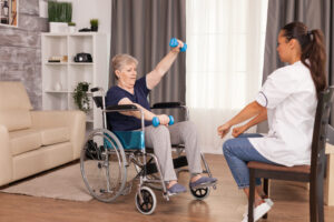 Invalid senior woman using weights