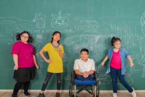 Portrait group of young Asian disabled child student standing in