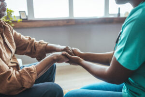 Professional care for elderly at assisted living facility.