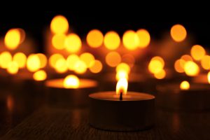 Burning candles on dark background