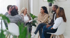 Group of people talking in a mental health group